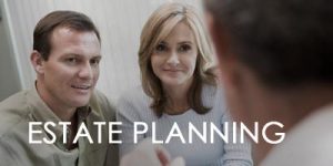 Couple consulting with attorney for estate planning.